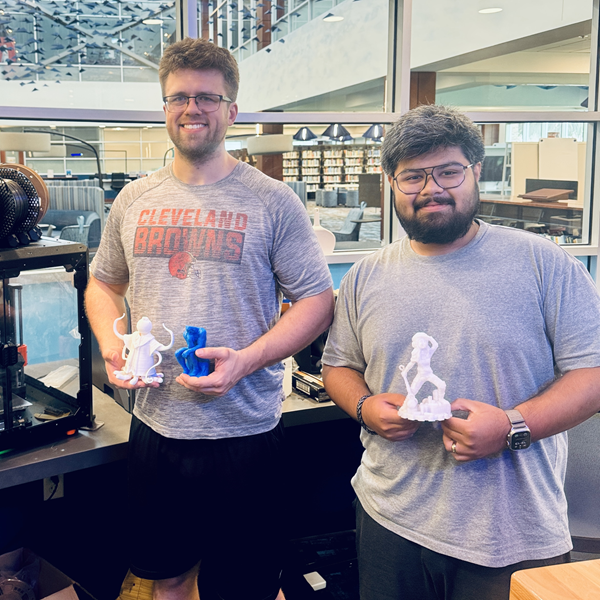 Students in Makerspace with 3D printed sculptures