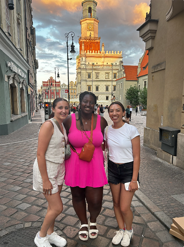 Three women in front of a Polish castle