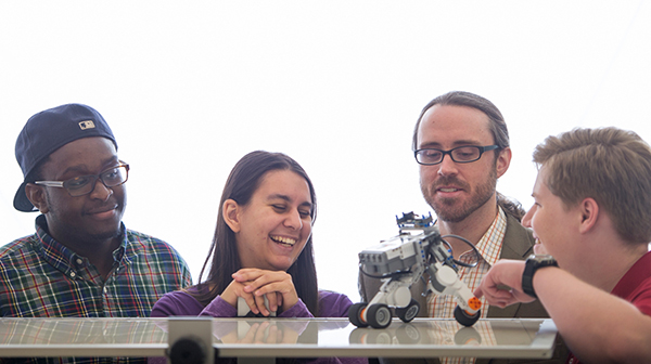 professor with robot and students