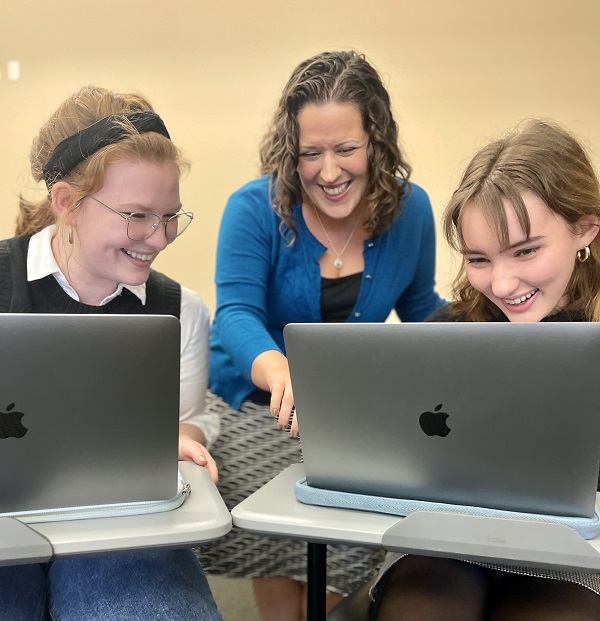 English Professor with Laptop Students