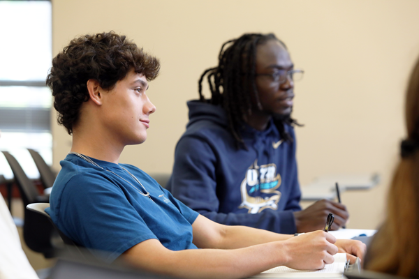 Two students at classroom desks