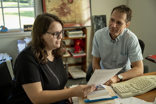 Faculty and Student Reviewing Paper