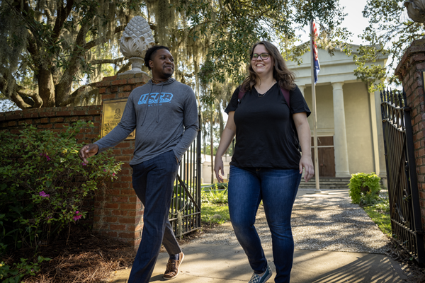 Students walking on campus outside