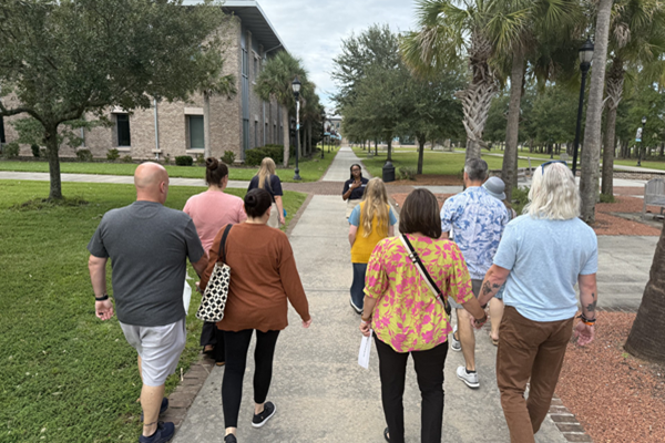 Students walking in group tour of campus