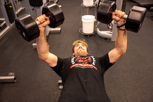 Student Working Out Lifting Weights