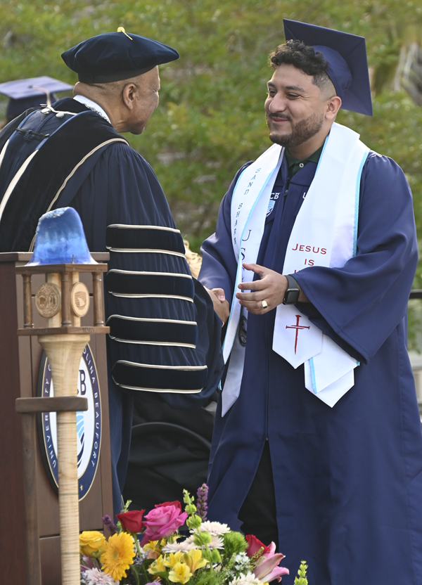 Chancellor awarding student