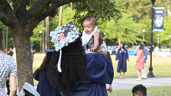 Graduation student with baby