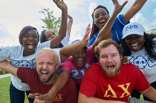 Fraternity and sorority members smiling