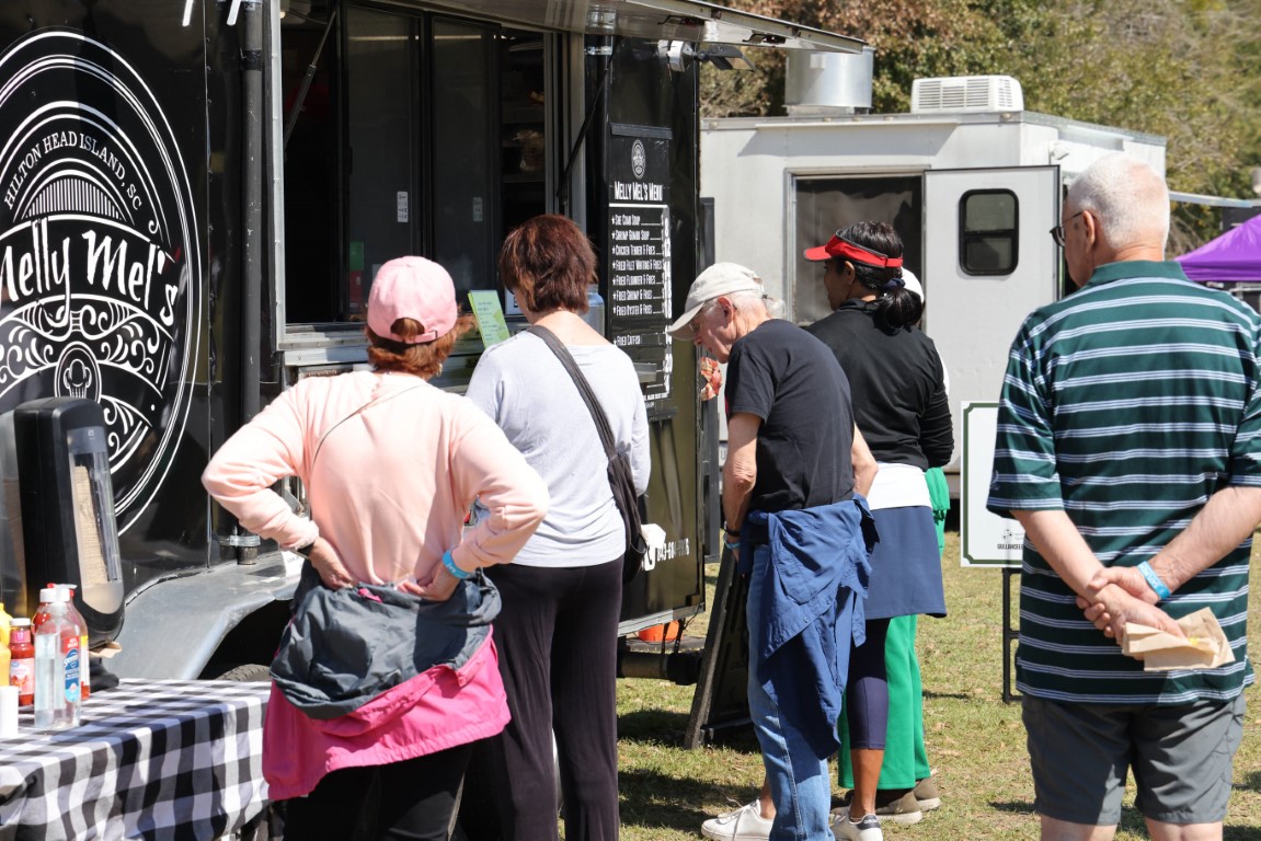 People waiting in line for Melly Mel's Food Truck