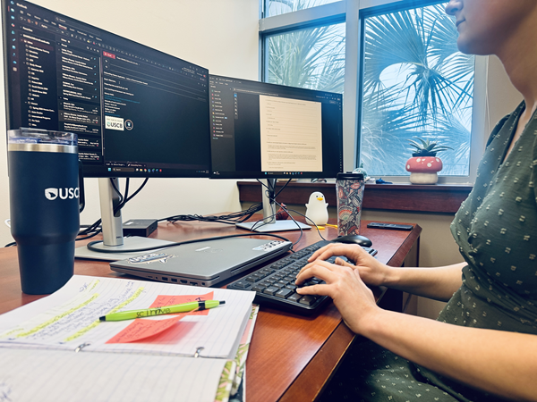 Employee working at desk with computer