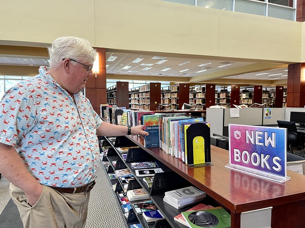Faculty with Library Books Display
