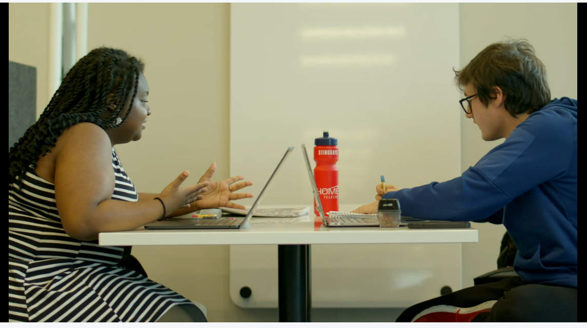 Students at a table in the library