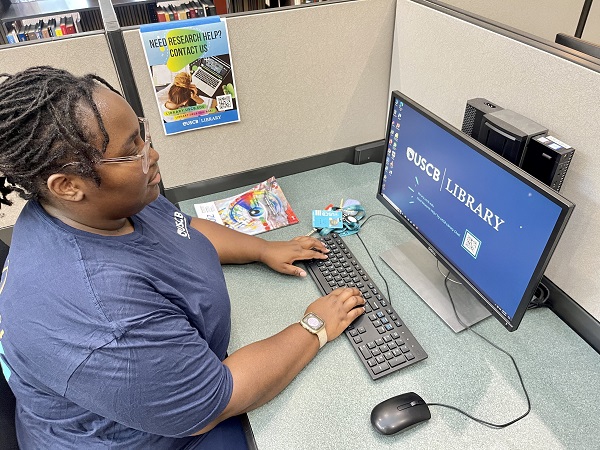 Student Using Computer at Library