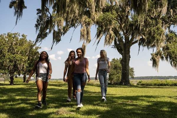 Students Walking by Marsh