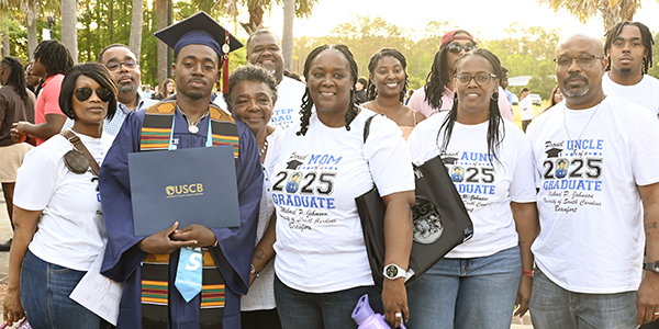 happy graduate with family