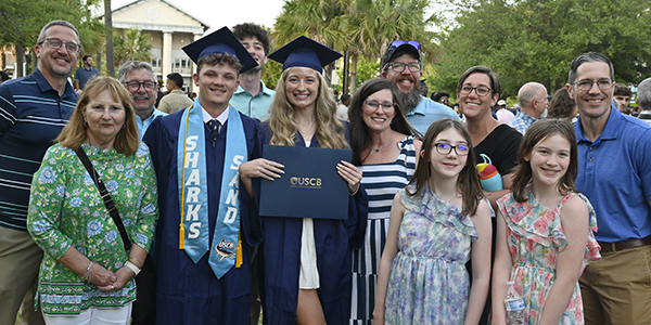 happy grads with family