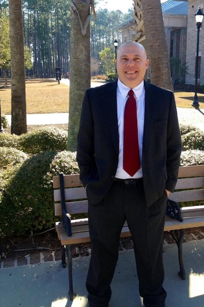 Student in front of bench