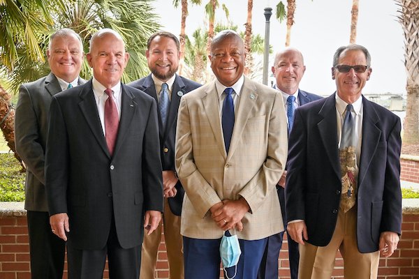 USCB Chancellor Dr. Al Panu (front row, center) and (left to right) Dr. Rich Gough, President of Technical College of the Lowcountry; Warren Parker, Chairman of South Coast Cyber Center; Stephen Murray, Beaufort Mayor and Vice Chairman of South Coast Cyber Center; John O'Toole, Executive Director of Beaufort County Economic Development Corp and Kevin Klingler, Chairman of Beaufort Digital Corridor will collaborate closely to develop cyber security academic programs and workforce development. USCB Chancellor Dr. Al Panu (front row, center) and (left to right) Dr. Rich Gough, President of Technical College of the Lowcountry; Warren Parker, Chairman of South Coast Cyber Center; Stephen Murray, Beaufort Mayor and Vice Chairman of South Coast Cyber Center; John O'Toole, Executive Director of Beaufort County Economic Development Corp and Kevin Klingler, Chairman of Beaufort Digital Corridor will collaborate closely to develop cyber security academic programs and workforce development.