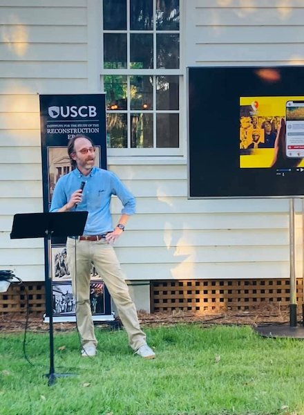 Professor giving speech outside