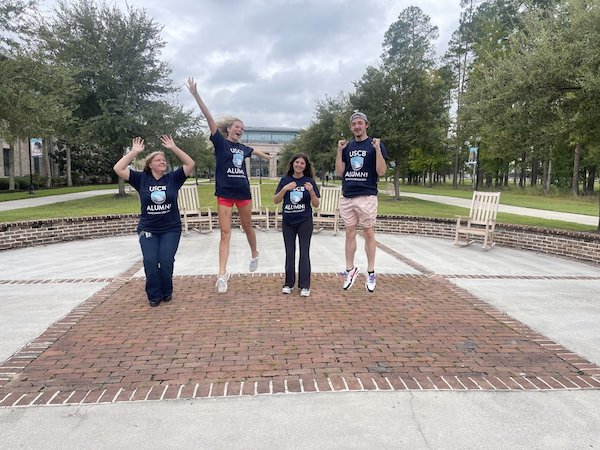 Students Jumping with USCB shirts on