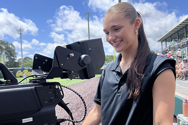 Young women operating a TV camera