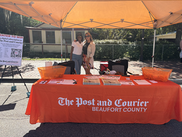 Natalie and Tia at advertising table