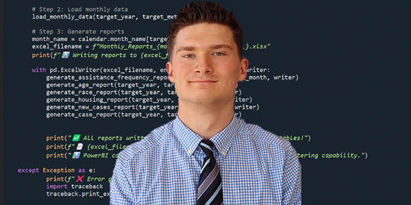 Young man posing in front of computer code