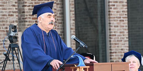 A man speaking at a podium