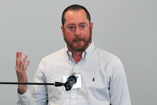 A man speaking at a podium