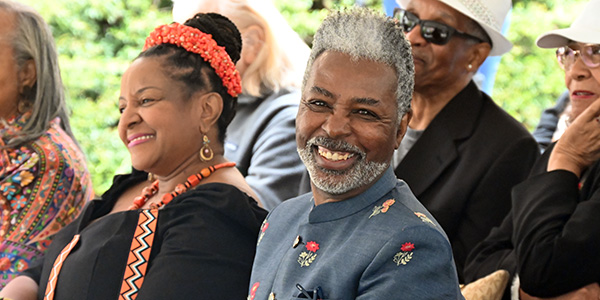 A man and a womwn smiling