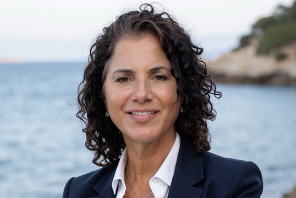 A woman standing near the sea